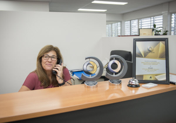 Woman on the front desk using the telephone