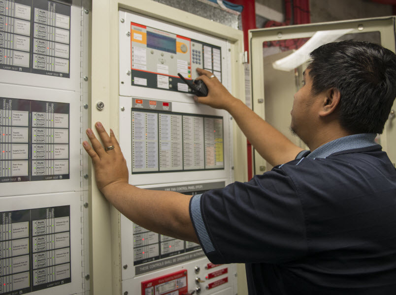 Fire safety expert checking the main control of fire system