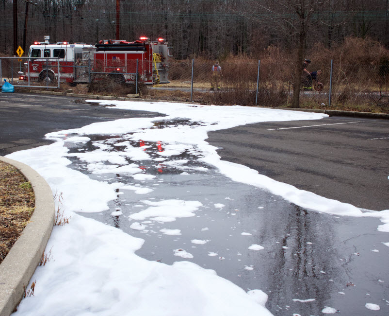 Firefighting foam from the firetruck remains on the road